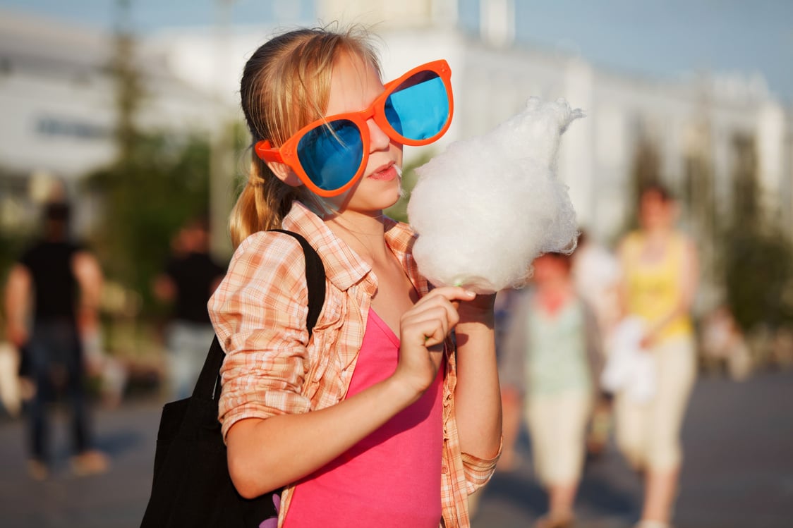 Girl eating cotton candy